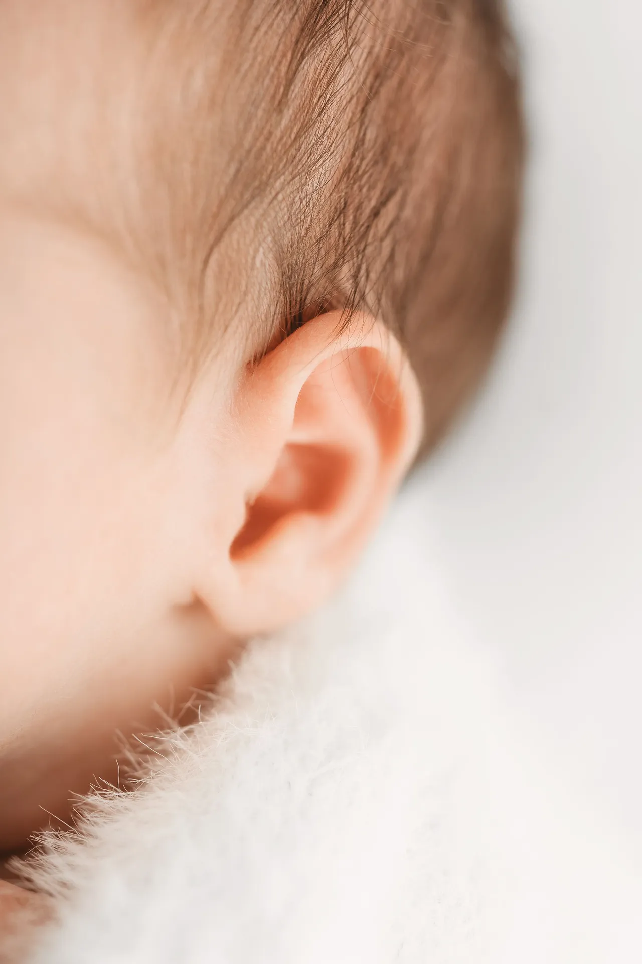 Close-up detail of a newborn baby's ear and fine hair - Kingston upon Thames newborn photographer