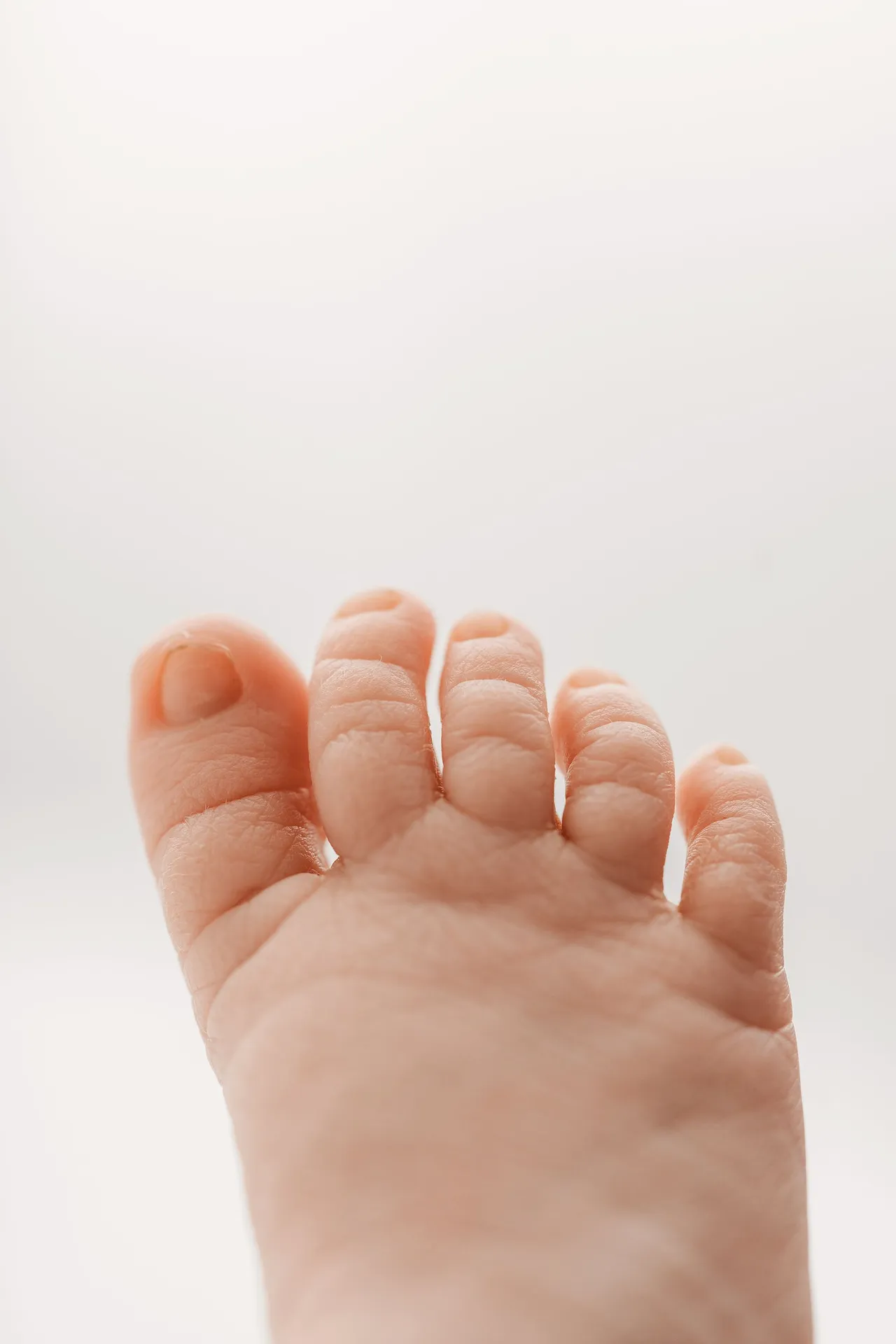 Close-up of newborn baby toes in safe, gentle photography setting at Kingston upon Thames studio