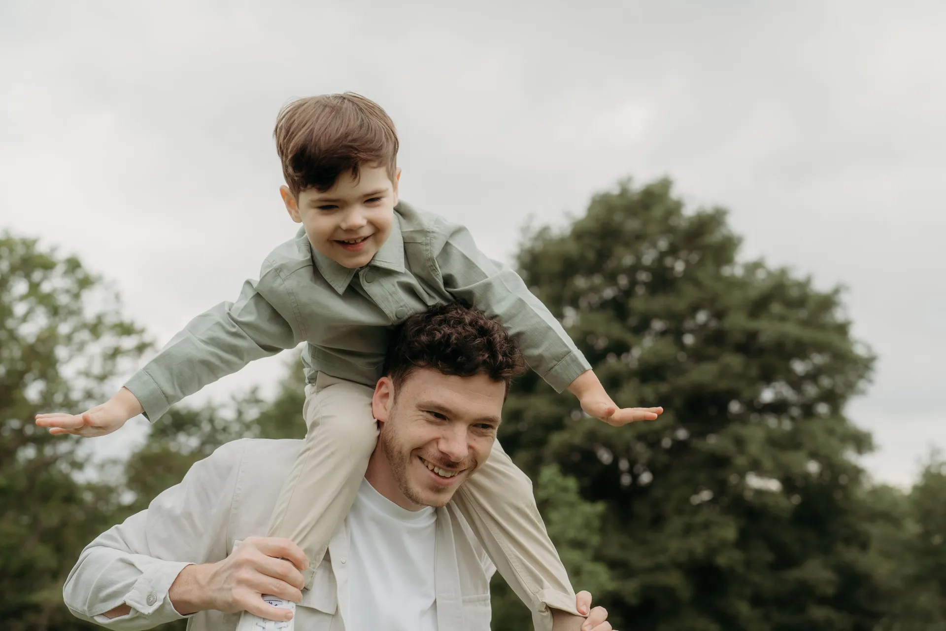 Playful piggyback ride moment in a lush green field